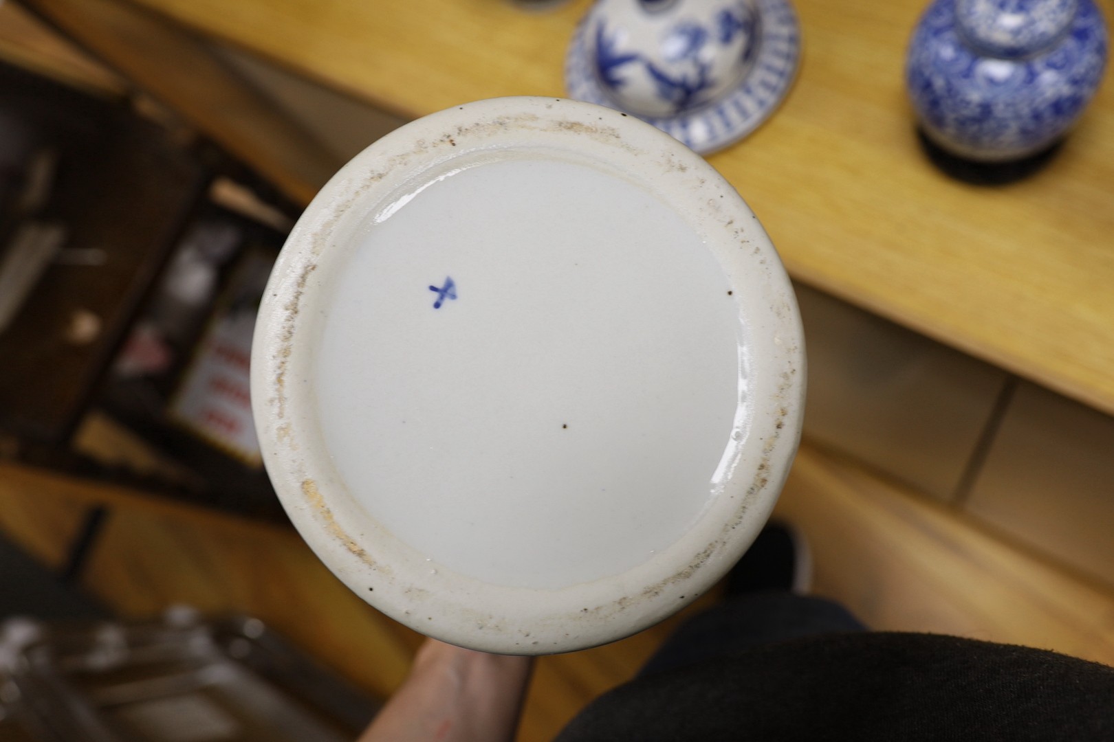 A pair of Japanese black ground vases, a pair of Chinese blue and white vases and covers, a similar pair of jars and a vase, four wood stands. Largest 41cm